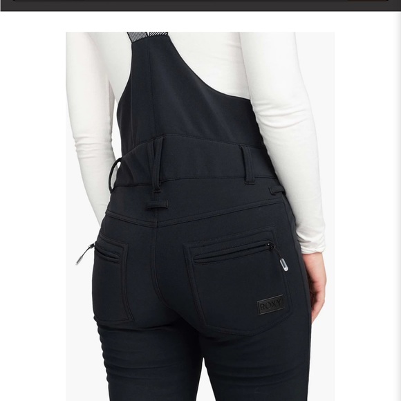 Roxy Women's Summit Bib Pants in pink. - Picture 9 of 9